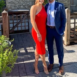Red strapless dress with a slit in the back.